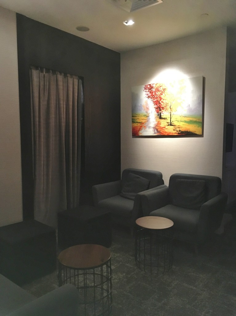 Waiting lounge with comfy armchairs at Spa Infinity