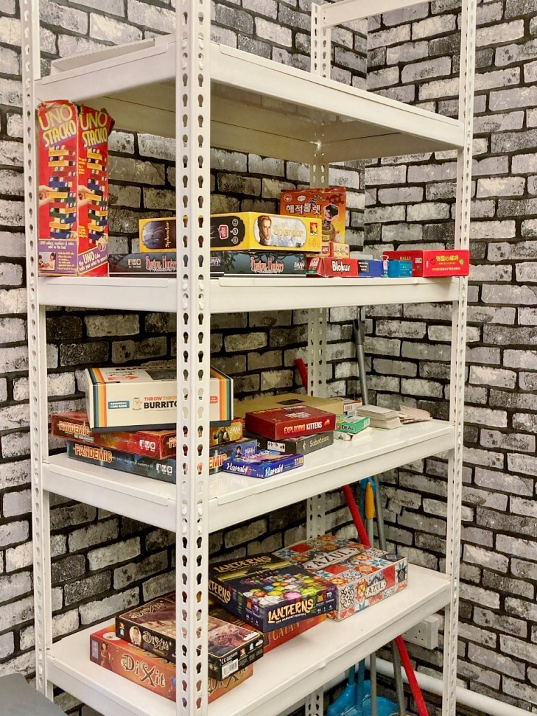 Shelf of board games at Enchanted Manor