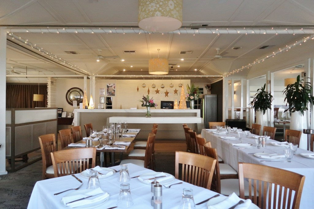 Indoor seating area and cashier counter at Summit Restaurant & Bar