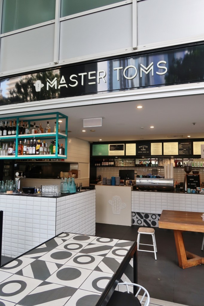 Seating area at Master Tom's Espresso Burger Bar