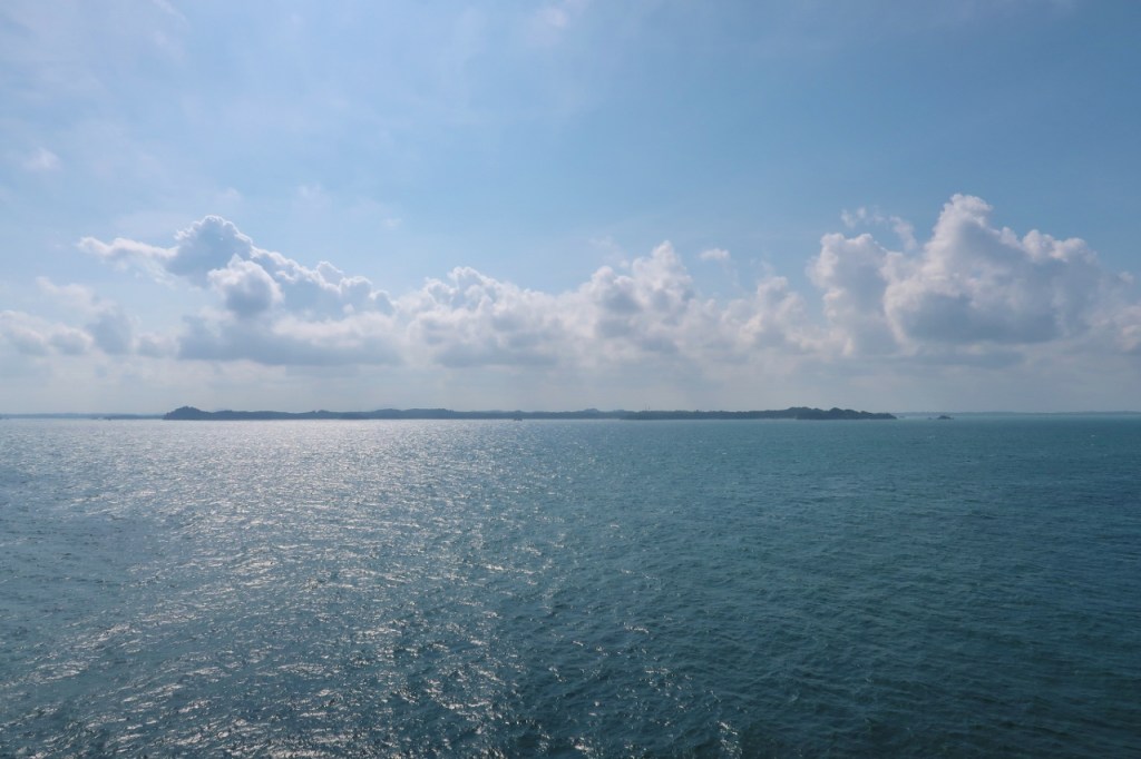 The view of the sea and sky from our balcony when the Genting Dream Cruises ship docked