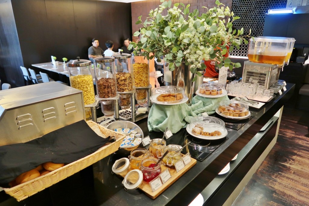 The Marmalade Pantry's breakfast buffet spread of pastries and cereal at Oasia Hotel Novena