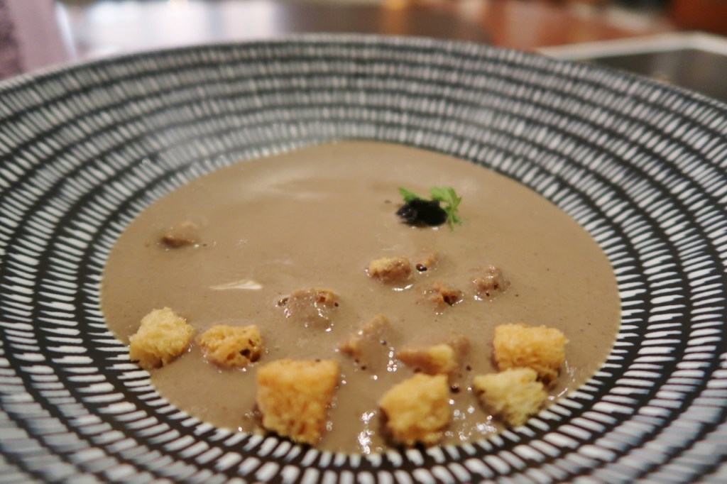 Wild mushroom soup dish at Racines at Sofitel Singapore City Centre hotel