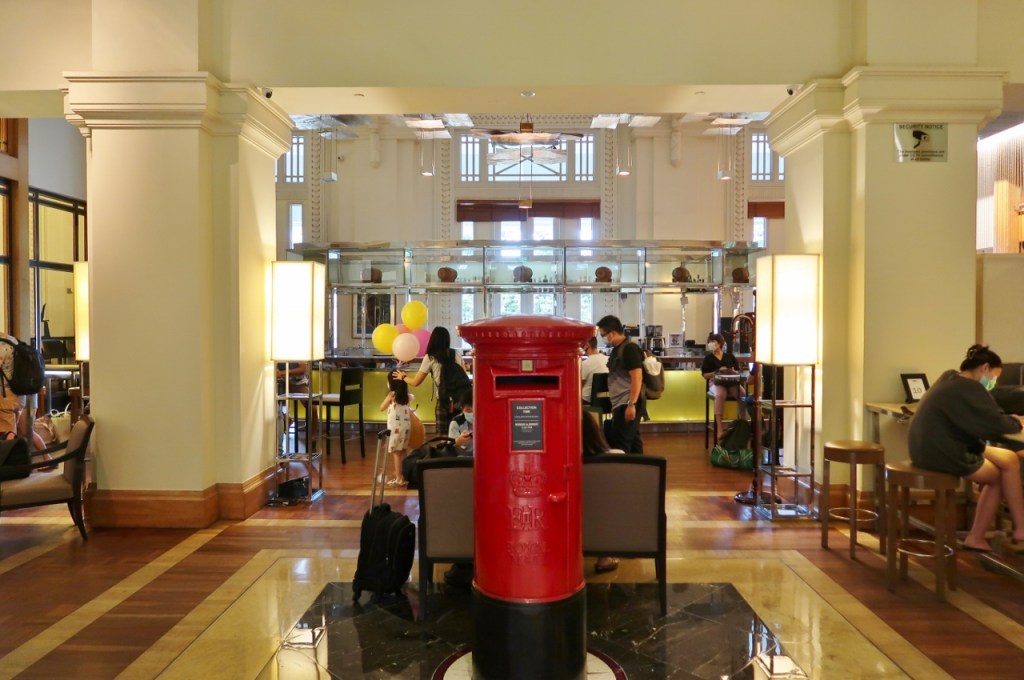 Guests waiting at The Post Bar to check in at The Fullerton Hotel