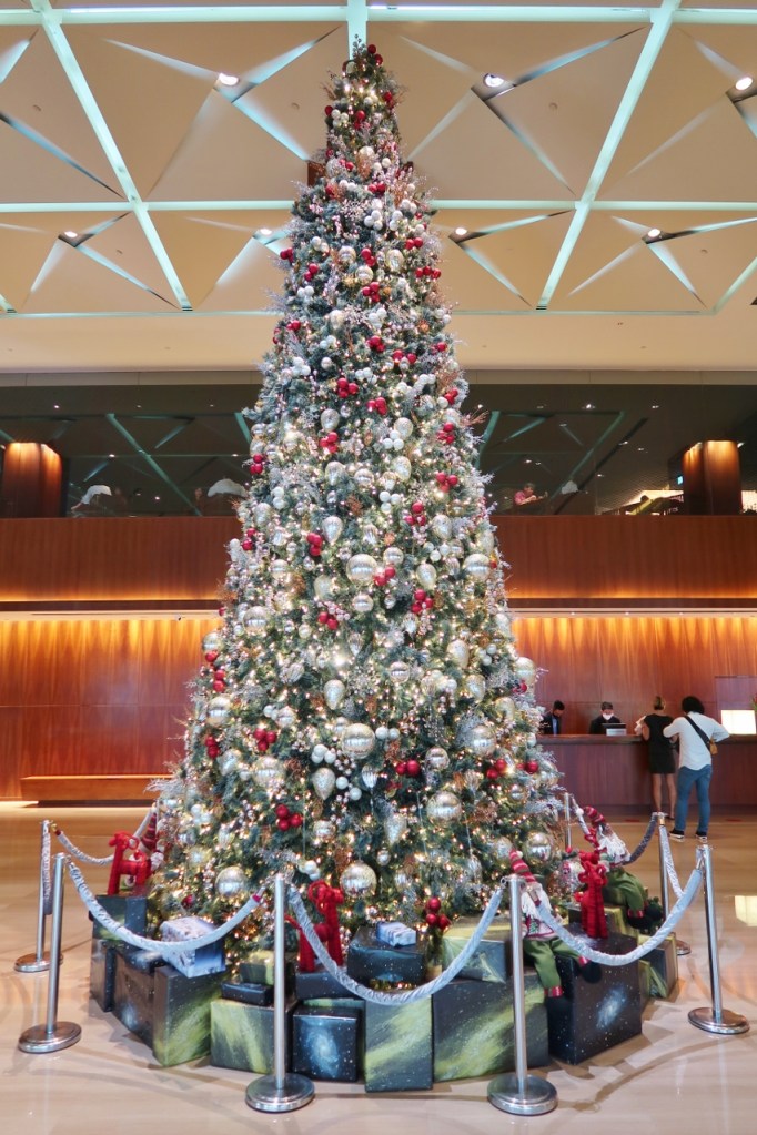 Christmas tree in the lobby leading to the reception counter at Grand Hyatt hotel