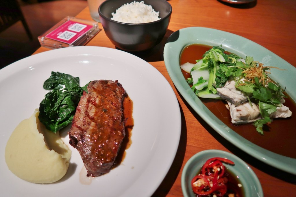 Beef steak and steamed barramundi with rice from Mezza9 restaurant at Grand Hyatt hotel
