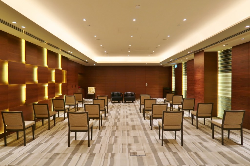 Function room lined with chairs at Grand Hyatt hotel