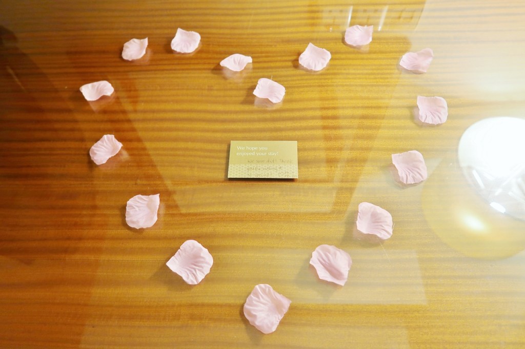 Rose petals forming a heart shape with a thank-you message in the middle for the staff at Mandarin Orchard Hotel