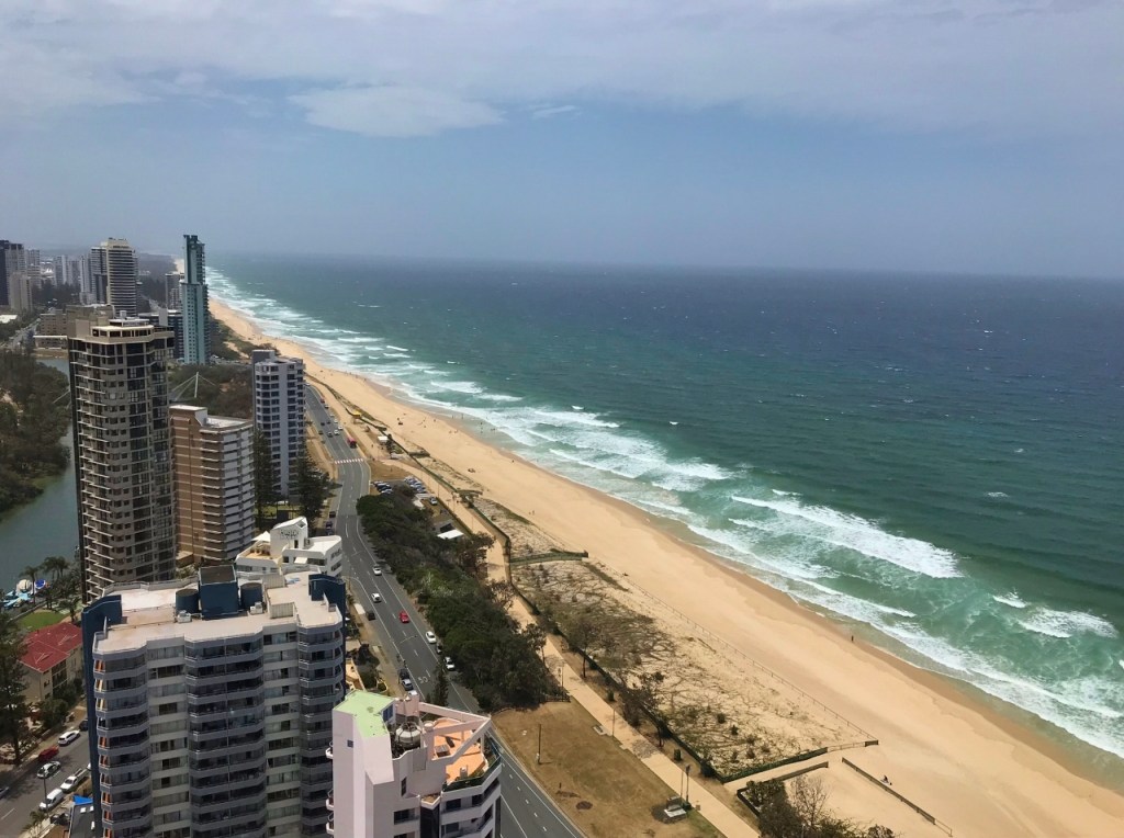 The view of the beach and surrounding buildings from Rhapsody Resort's Ocean View Apartment