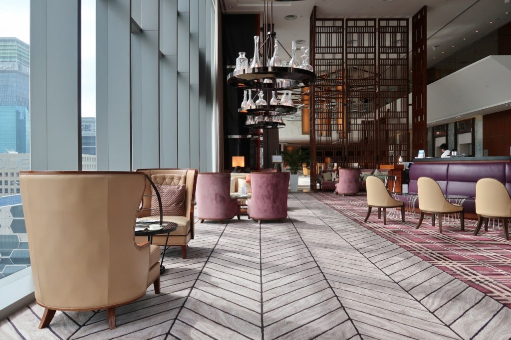 Seating area with plush armchairs and carpets at the Lobby Lounge at The Westin Hotel