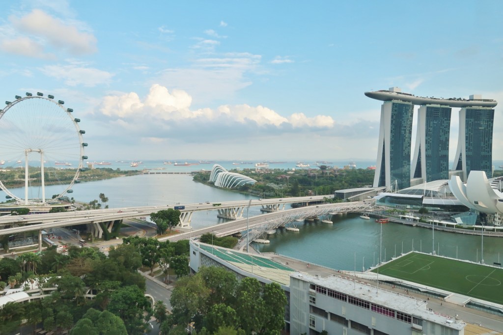 The view of Singapore Flyer, Marina Bay Sands hotel and Gardens By The Bay from Ocean View Room at Mandarin Oriental Hotel