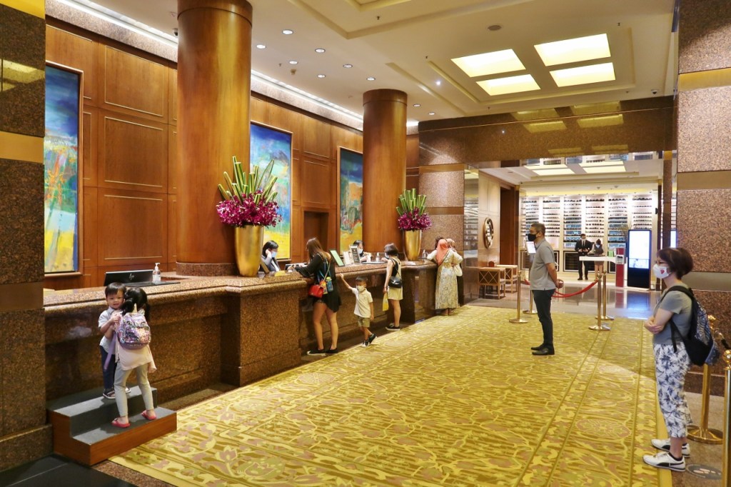 Reception counter at Conrad Centennial Hotel