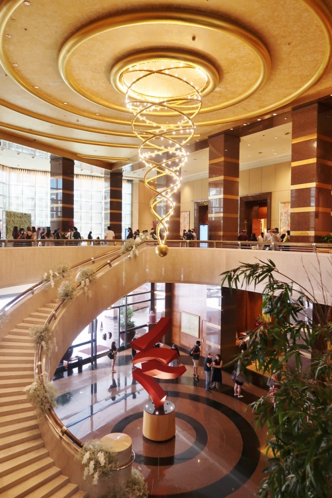 Lobby reception area and entrance to ballroom at Conrad Centennial Hotel