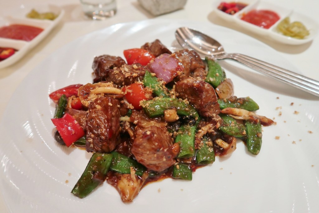 Sautéed Angus tenderloin cubes dish from Golden Peony at Conrad Centennial Hotel