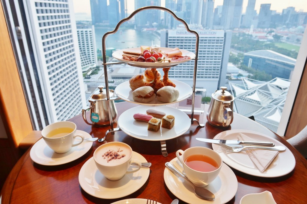 Three-tier evening canapes and drinks served at Conrad Centennial Hotel's club lounge