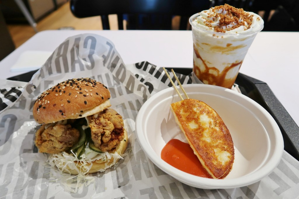 Crispy chicken burger, grilled halloumi cheese skewers and vanilla milkshake from CARNE Burgers restaurant