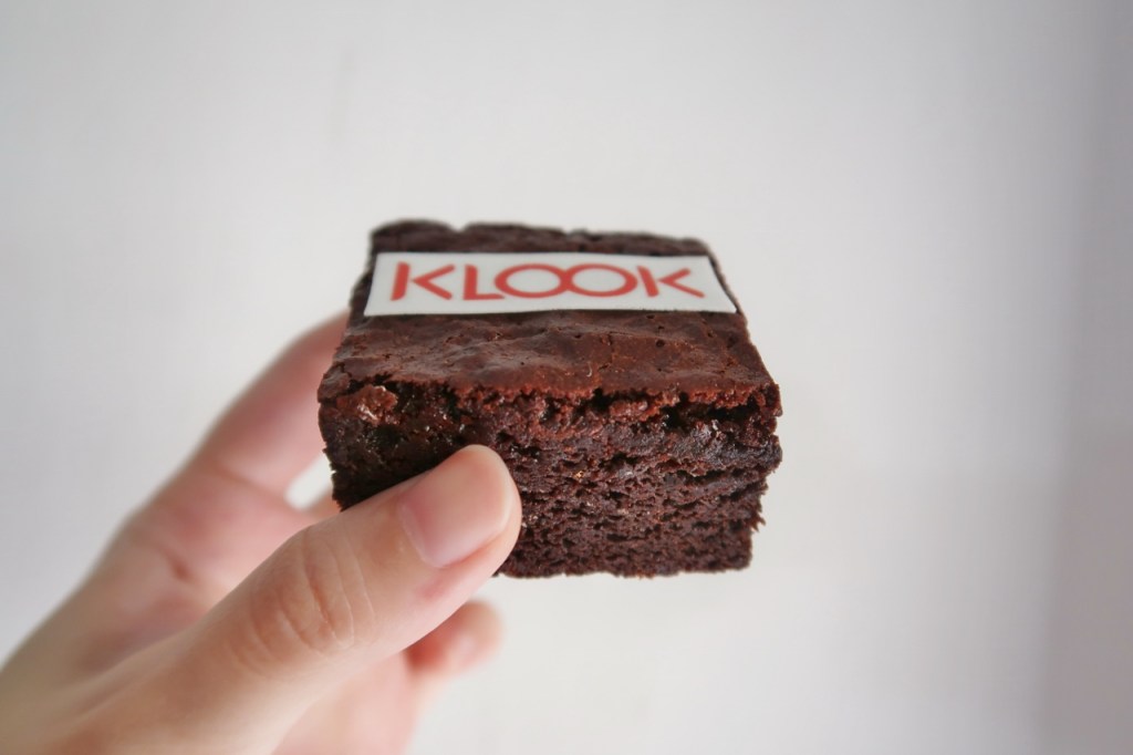 Au Naturel brownie square with customized Klook logo on top from Bob The Baker Boy