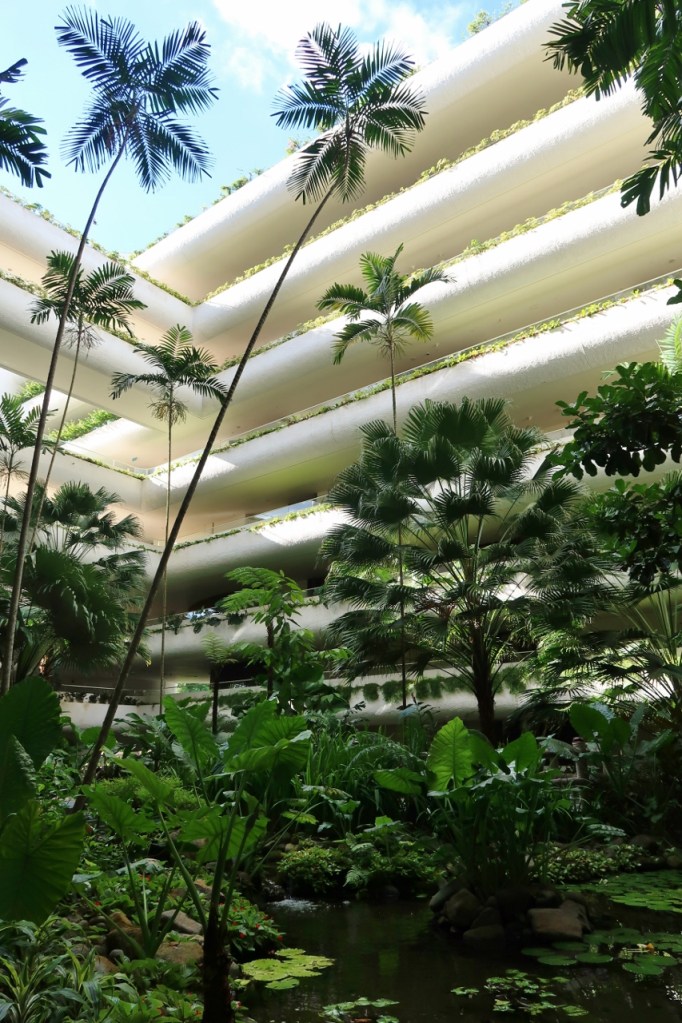 Lush greenery around the pond at Shangri-La Hotel Garden Wing atrium