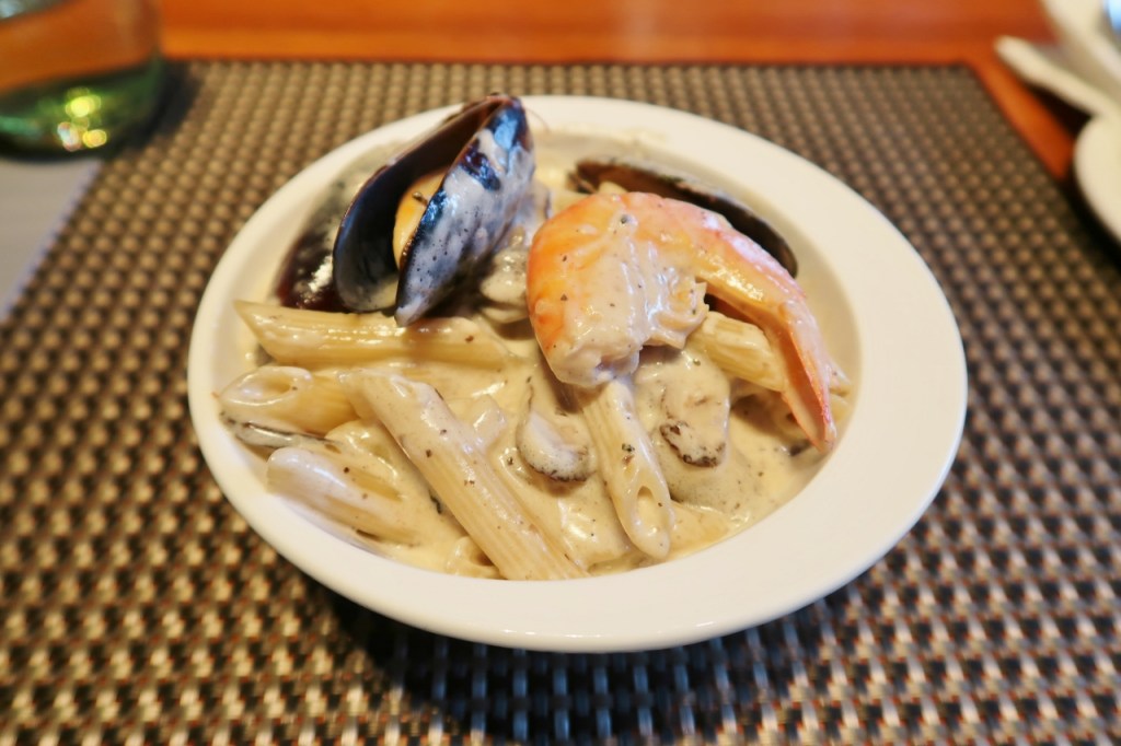 A bowl of seafood and mushroom cream pasta from the cooking class at PARKROYAL COLLECTION Pickering Hotel's Lime Restaurant
