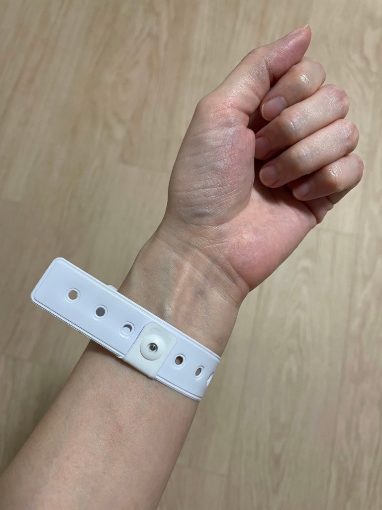 My arm with a tagged wristband on it