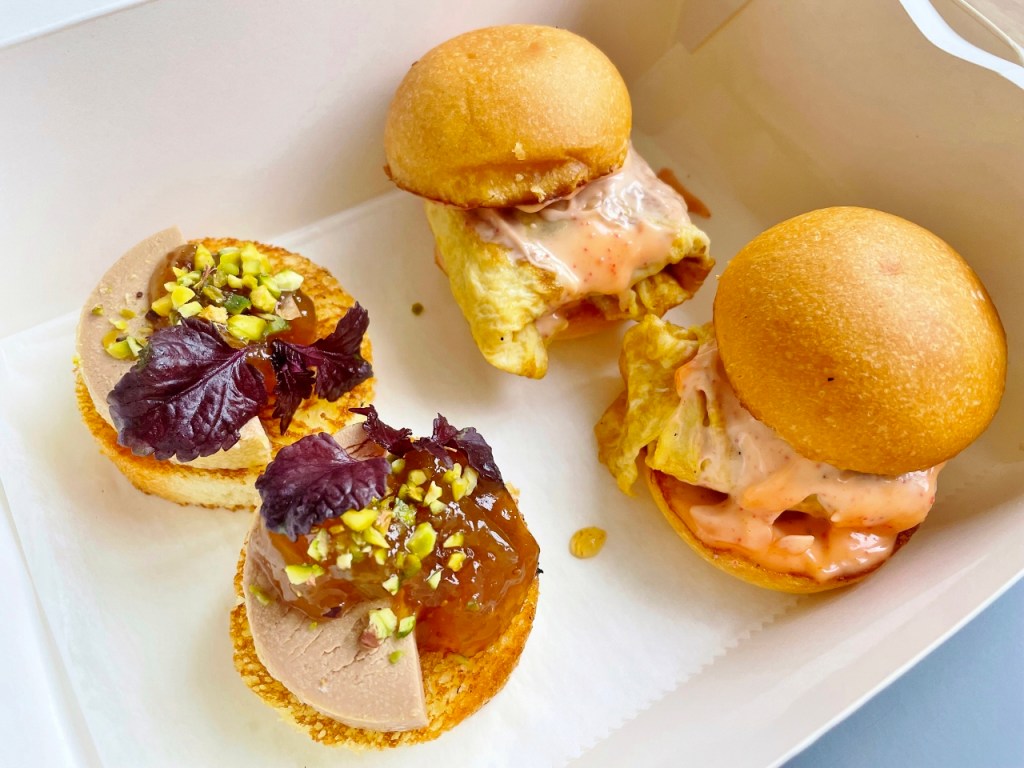A pair of chicken mentaiko sliders and foie gras terrine from Tablescape Restaurant's National Day Sofa Menu