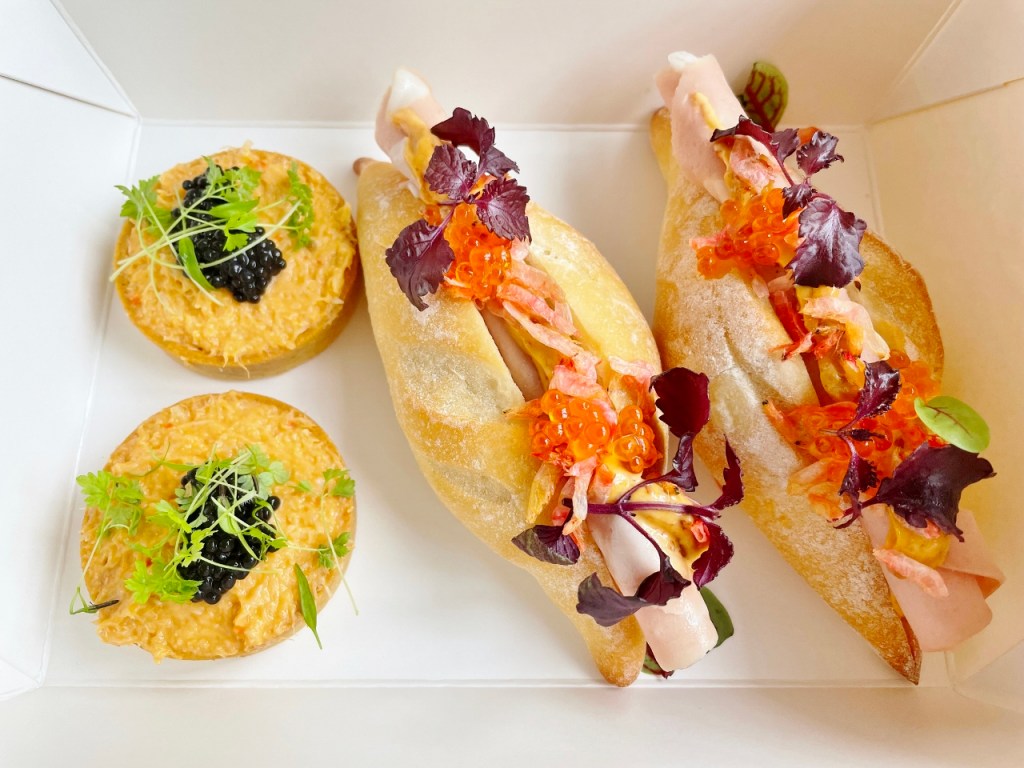 A pair of ham baguettes and chilli crab tartlets from Tablescape Restaurant's National Day Sofa Menu