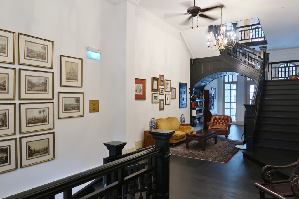 Seating area in the library at Raffles Hotel
