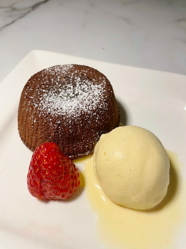 Lava cake with vanilla gelato from Florian restaurant at Naumi Hotel