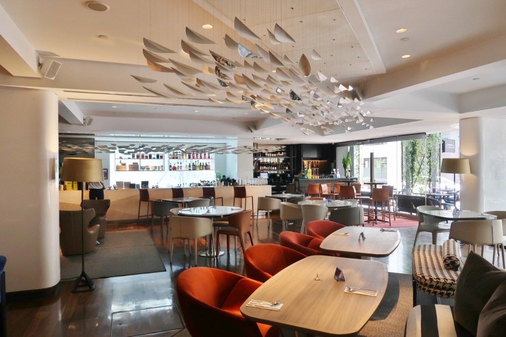 Seating area at Florian restaurant at Naumi Hotel