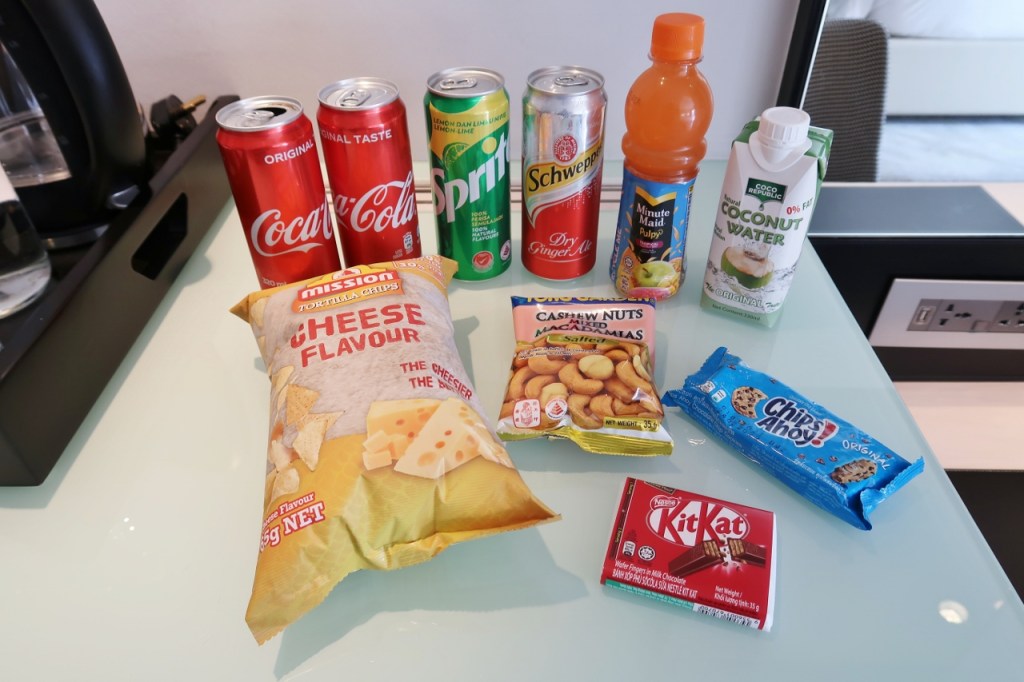 Mini-bar snacks and drinks in Oasis Room at Naumi Hotel