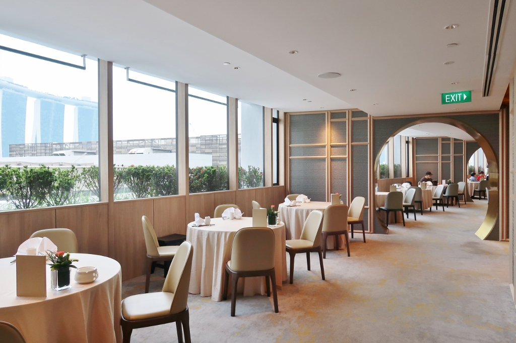 Seating area at Peach Blossoms restaurant at PARKROYAL COLLECTION Marina Bay Hotel
