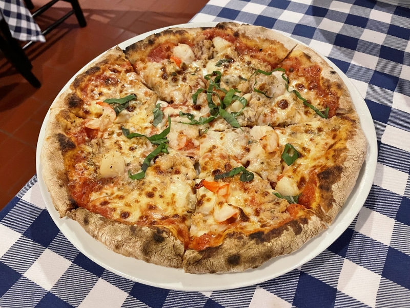 Seafood pizza from Pete's Place restaurant at Grand Hyatt Hotel