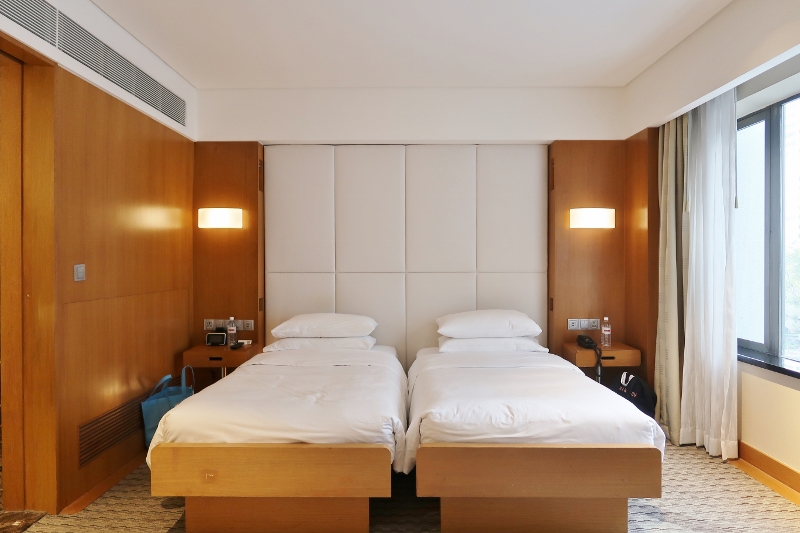 Bedroom in Twin Bed Deluxe Room at Grand Hyatt Hotel