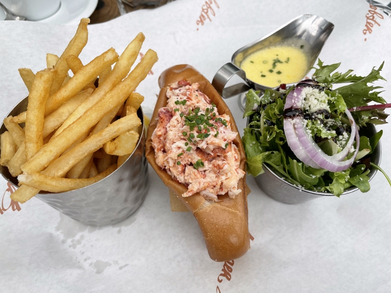 Original lobster roll, fries and salad from Burger & Lobster Restaurant