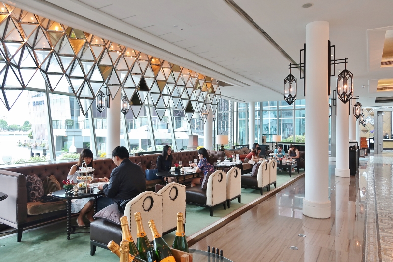 Indoor seating area at The Landing Point restaurant at The Fullerton Bay Hotel
