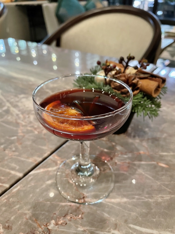 Complimentary glass of housemade mulled wine from One-Ninety Bar at Four Seasons Hotel