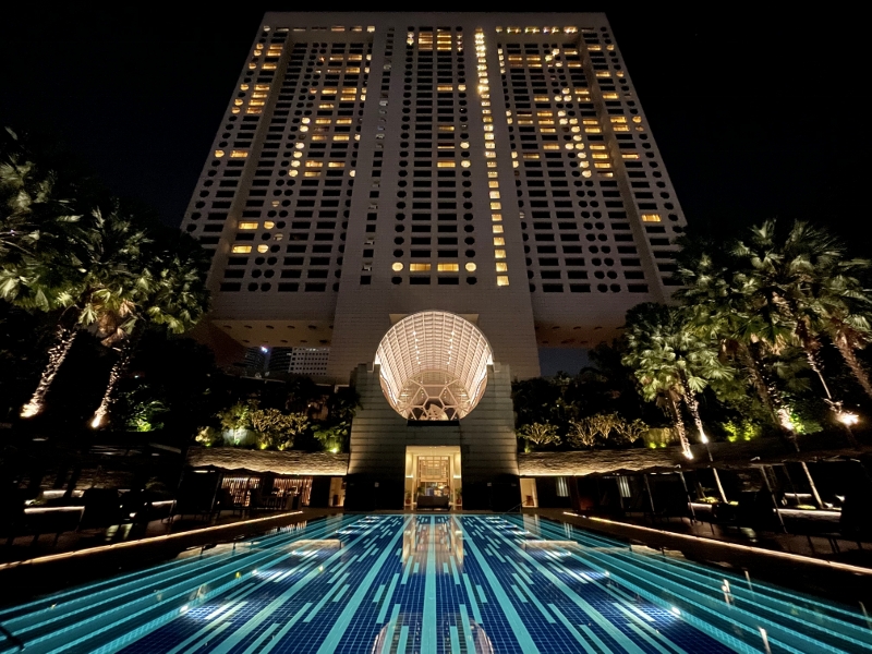 Swimming pool at night at The Ritz-Carlton Millenia Hotel