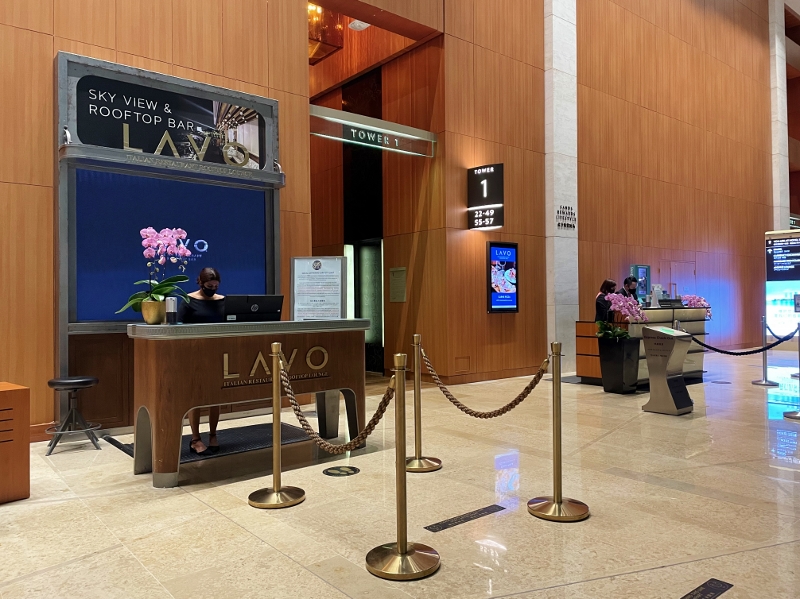 Reception desk at the lift lobby leading up to LAVO Italian Restaurant & Rooftop Bar