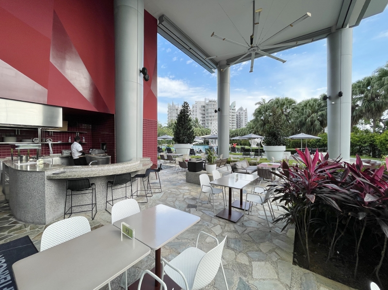 Outdoor seating area at The Kitchen Table restaurant at W Hotel Sentosa Cove