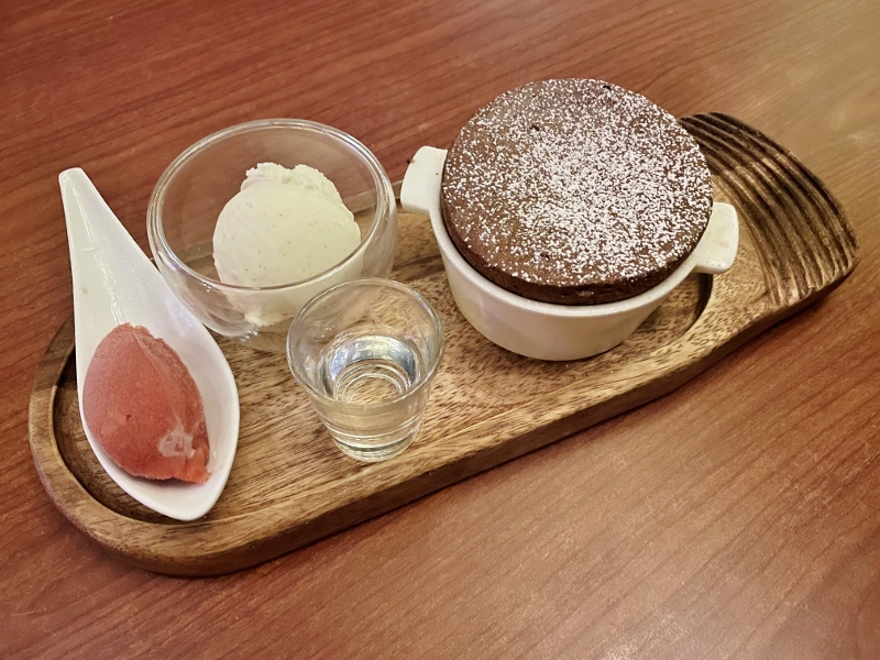 Dark chocolate soufflé with plum and burgundy wine sorbet from SKIRT restaurant at W Hotel Sentosa Cove
