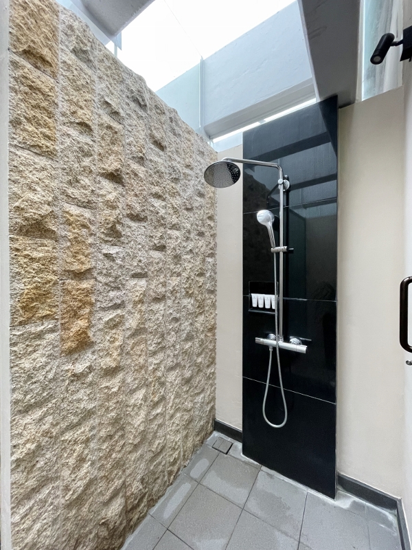 Outdoor shower area attached to treatment room in St. Gregory Spa at Pan Pacific Hotel