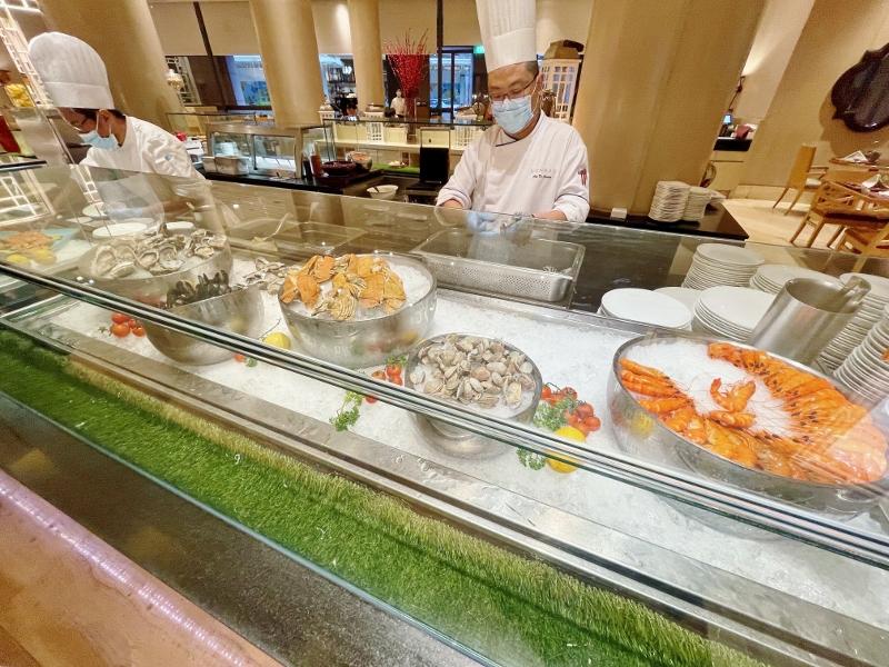 Seafood buffet station at Oscar's Restaurant at Conrad Centennial Hotel