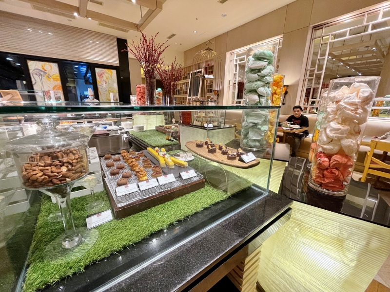 Dessert buffet station at Oscar's Restaurant at Conrad Centennial Hotel