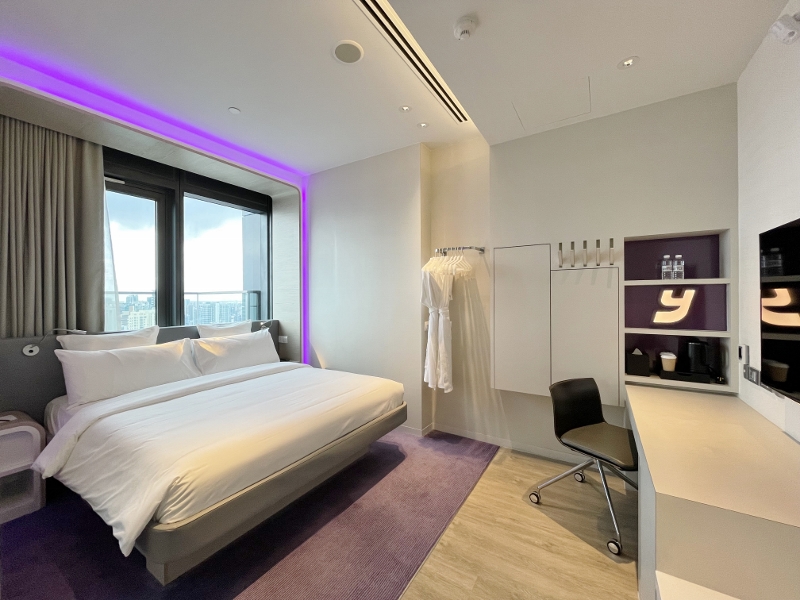 Bedroom in VIP King Suite View at YOTEL Orchard Hotel