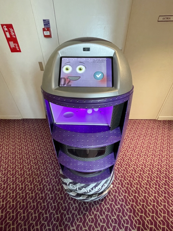 Yolanda robot butler delivering water bottles to the room at YOTEL Orchard Hotel
