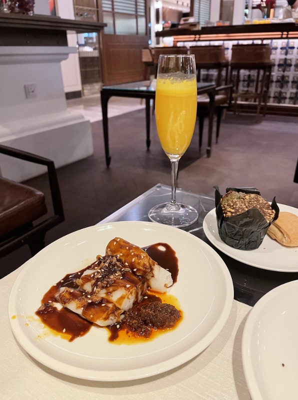 Breakfast buffet dishes and a mimosa drink from 15 Stamford by Alvin Leung restaurant at The Capitol Kempinski Hotel