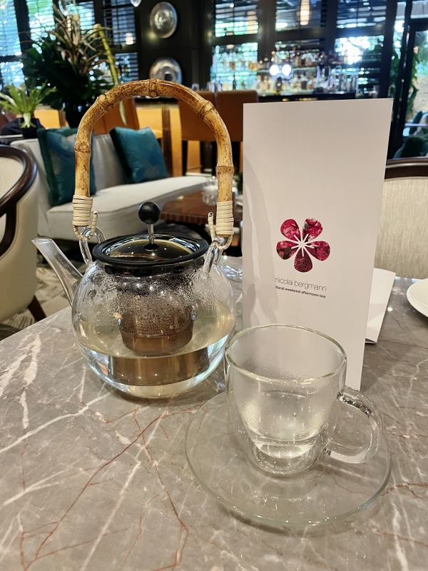 A pot of pink rose and marigold tea from One-Ninety Bar at Four Seasons Hotel