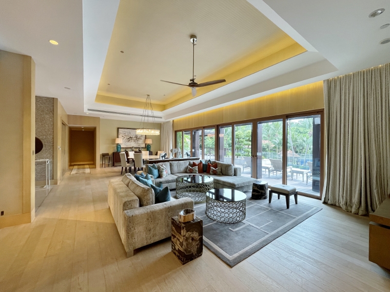 The Palace living room and dining area at Equarius Villas