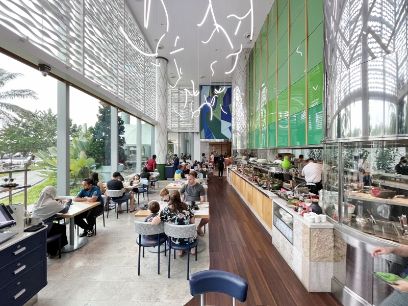 Indoor seating area at The Kitchen Table restaurant at W Hotel Sentosa Cove