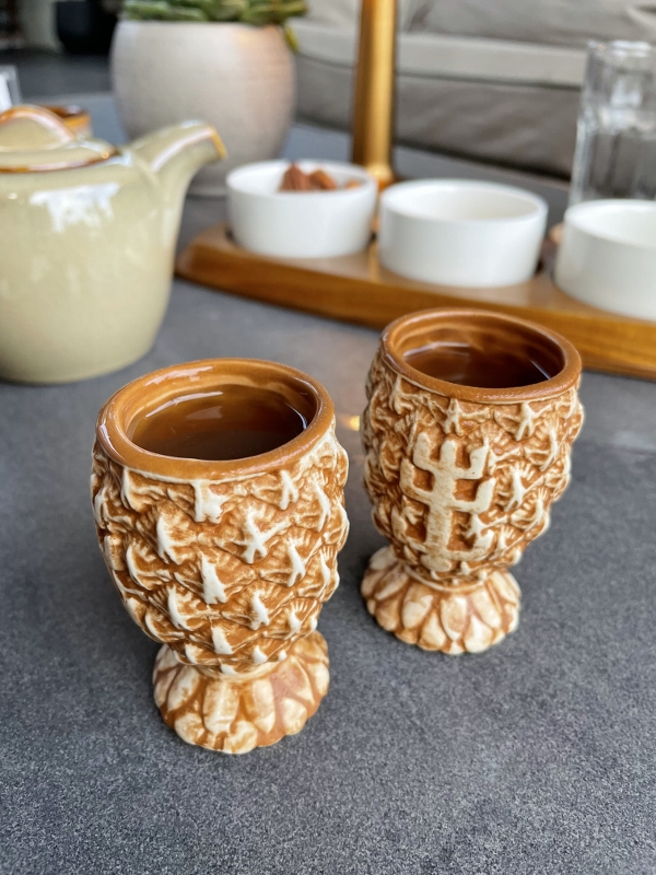 Two shots of Grog rum during the Bosun's Call ceremony at Bob's Bar at Capella Hotel